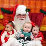 Santa Claus holding babies