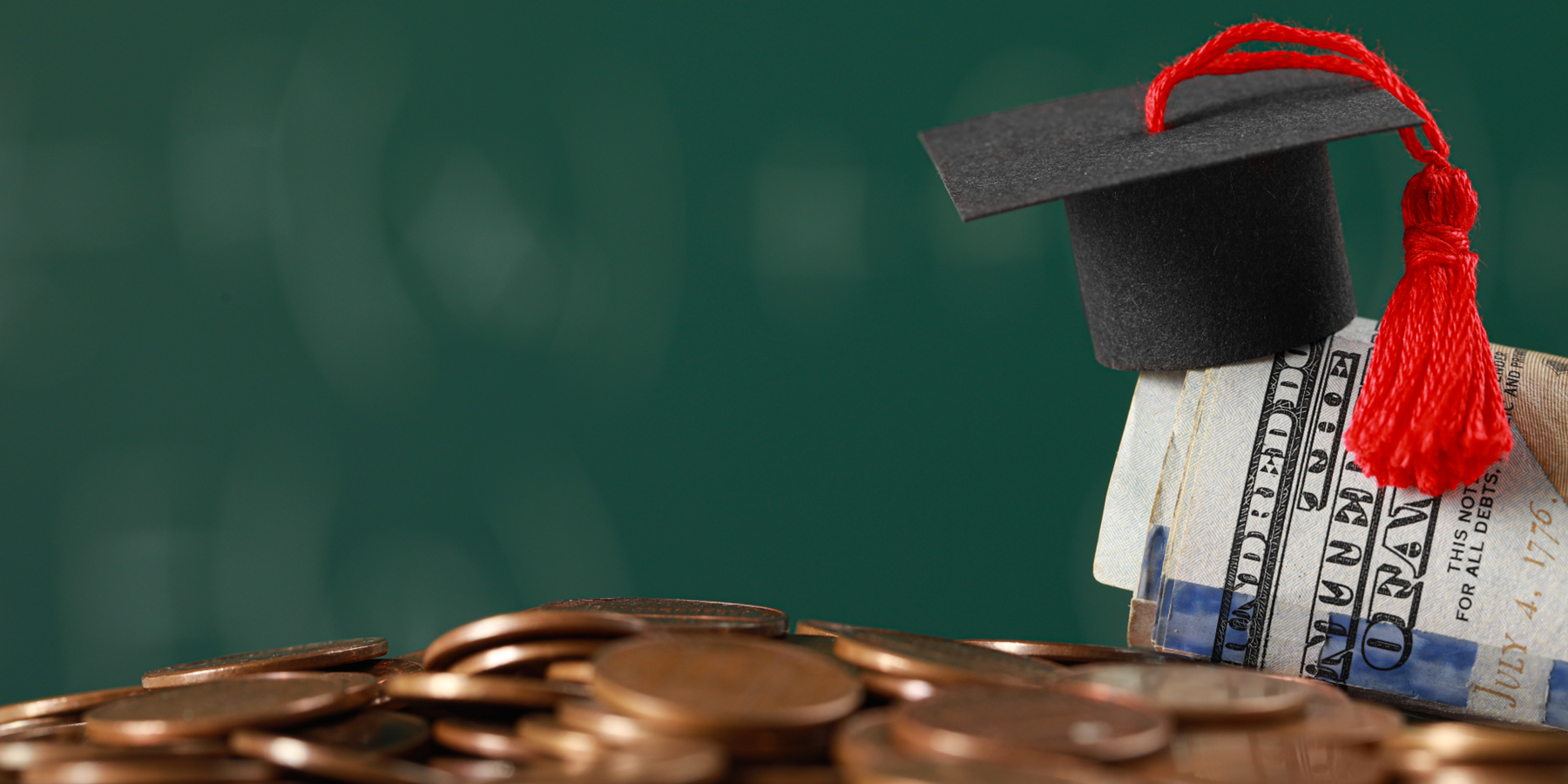 Graduation cap sitting on top money